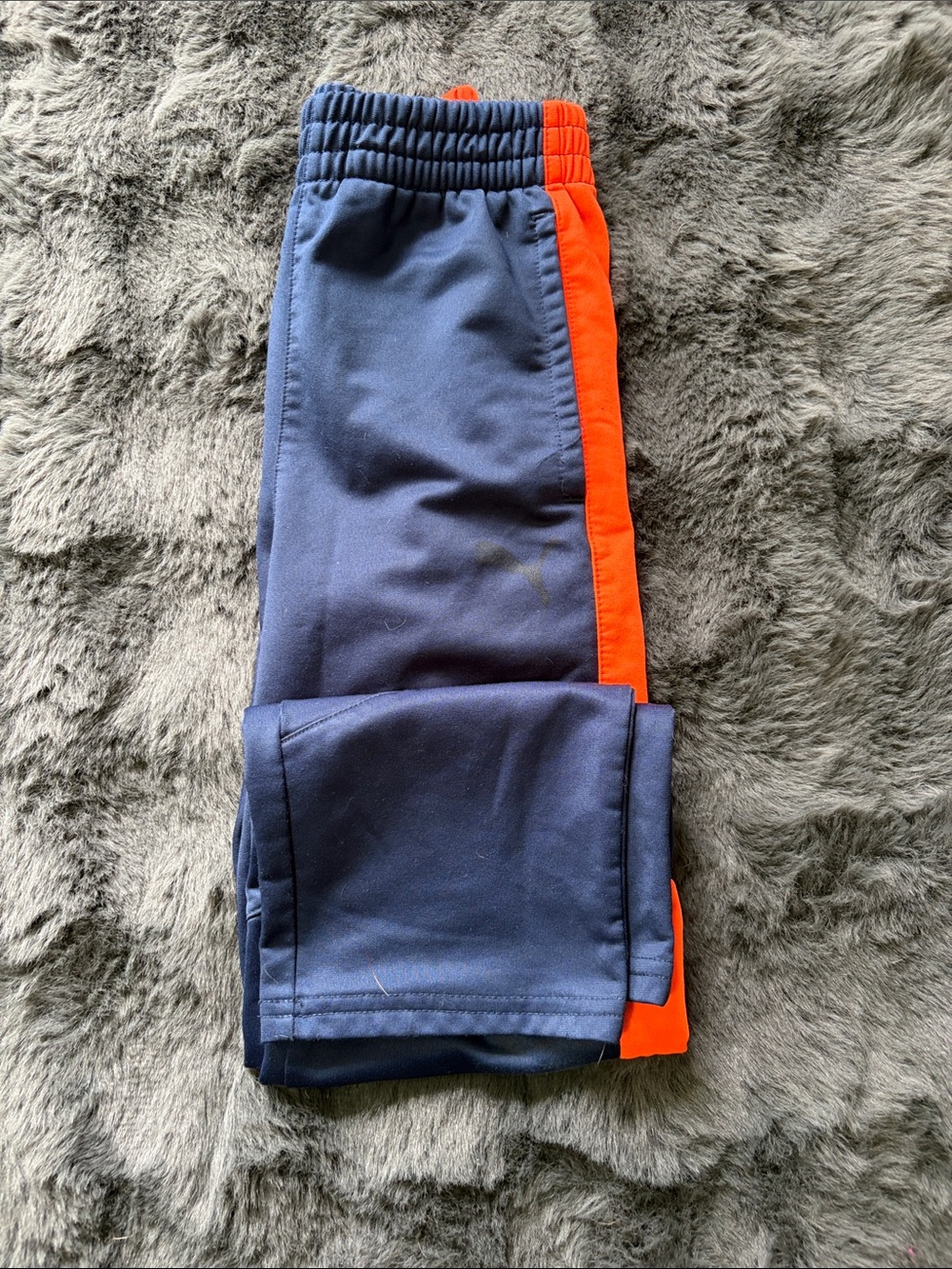 Kids PUMA Navy Blue Track Pants with Orange Side Stripe